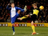 Alexander Merkel of Watford in action with Brian Howard of Birmingham during the Sky Bet Championship match between Watford and Birmingham City at Vicarage Road on February 11, 2014