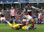 Vito Mannone of Sunderland dives to make a save at the feet of George Boyd of Burnley during the Barclays Premier League match between Burnley and Sunderland at Turf Moor on September 20, 2014
