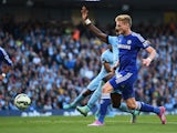 Andre Schurrle of Chelsea scores the first goal during the Barclays Premier League match between Manchester City and Chelsea at the Etihad Stadium on September 21, 2014