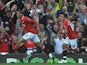 Manchester United's English defender Chris Smalling (L) celebrates after scoring the opening goal of the English Premier League football match against Chelsea on September 18, 2011