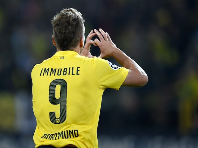 Dortmund's Italian striker Ciro Immobile celebrates scoring the 1-0 goal with during the first leg UEFA Champions League Group D football match against Arsenal on September 16, 2014