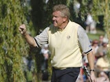 Colin Montgomerie drops a birdie putt on the 16th hole during Sunday afternoon singles matches at the 2004 Ryder Cup in Detroit, Michigan, September 19, 2004