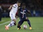 Lyon's French midfielder Corentin Tolisso (L) vies with Paris Saint-Germain's French defender Serge Aurier during the French L1 football match on September 21, 2014