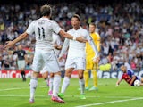 Cristiano Ronaldo of Real Madrid celebrates with Gareth Bale after scoring Real's 3rd goal during the UEFA Champions League Group B match  against Basel on September 16, 2014
