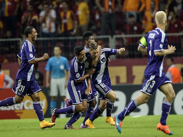 Anderlecht players celebrate their goal by midfielder Dennis Praet against Galatasaray during their UEFA Champions Leauge group D match on September 16, 2014