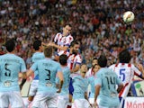 Diego Godin of Club Atletico de Madrid scores his team's 2nd goal during the La Liga match at the Vicente Calderon stadium on September 20, 2014