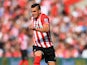 Dusan Tadic of Southampton evades Mike Williamson of Newcastle United during the Barclays Premier League match between Southampton and Newcastle United at St Mary's Stadium on September 13, 2014