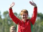 Wales's silver medalist Elena Allen celebrates on the podium at the medal ceremony for the women's Skeet at Barry Buddon Shooting Centre during the 2014 Commonwealth Games in Carnoustie, Scotland on July 25, 2014