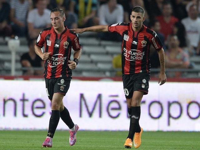 Nice's French midfielder Eric Bautheac (L) and Nice's French midfielder Valentin Eysseric reacts after Bautheac scored a goal during the French L1 football match against Nantes on September 20, 2014