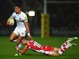 Chiefs player Henry Slade breaks the tackle of Gloucester centre Henry Purdey during the Aviva Premiership match between Gloucester Rugby and Exeter Chiefs at Kingsholm Stadium on September 19, 2014