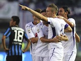 Jasmin Kurtic of ACF Fiorentina celebrates with his team-mates after scoring the opening goal during the Serie A match between Atalanta BC and ACF Fiorentina at Stadio Atleti Azzurri d'Italia on September 21, 2014