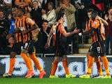 Mohamed Diame of Hull City celebrates with Andrew Robertson and Nikica Jelevic as he scores their second goal during Barclays Premier League match between Hull City and West Ham United at KC Stadium on September 15, 2014