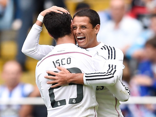 Javier Hernandez of Real Madrid CF celebrates with his teammate Isco after scoring against Deportivo on September 20, 2014