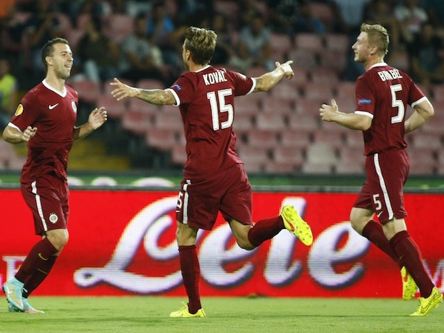 Sparta Prague's Czech midfielder Josef Husbauer (2ndR) celebrates with teammates after scoring during the UEFA Europa League Group I football match against SSC Napoli on September 18, 2014