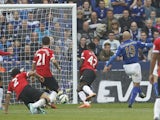Leicester City's Argentinian midfielder Esteban Cambiasso scores their third goal during the English Premier League football match between Leicester City and Manchester United at the King Power Stadium in Leicester on September 21, 2014