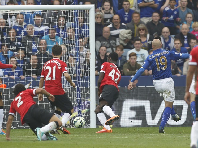 Leicester City's Argentinian midfielder Esteban Cambiasso scores their third goal during the English Premier League football match between Leicester City and Manchester United at the King Power Stadium in Leicester on September 21, 2014