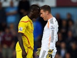 Mario Balotelli of Liverpool and Adrian of West Ham clash following a heavy tackle by Balotelli on Adrian during the Barclays Premier League match between West Ham United and Liverpool at Boleyn Ground on September 20, 2014