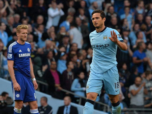 Manchester City's English midfielder Frank Lampard acknowledges the crowd after scoring his goal during the English Premier League football match between Manchester City and Chelsea at the Etihad Stadium in Manchester on September 21, 2014