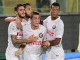 Inter Milan's Croatian midfielder Mateo Kovacic is congratulated after scoring during the Serie A football match Palermo vs Inter Milan at Renzo Barbera Stadium in Palermo on September 21, 2014