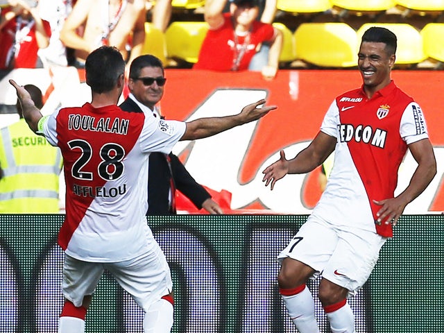 Monaco's Moroccan midfielder Nabil Dirar celebrates after scoring a goal with Monaco's French midfielder Jeremy Toulalan during the French L1 football match Monaco (ASM) vs Guingamp (EAG) on September 21, 2014