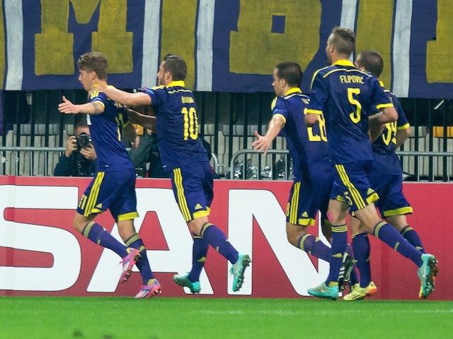 NK Maribor's players celebrate after scoring during the UEFA Group G Champions League footbal match NK Maribor vs Sporting Lisbon in Maribor, Slovenia on September 17, 2014