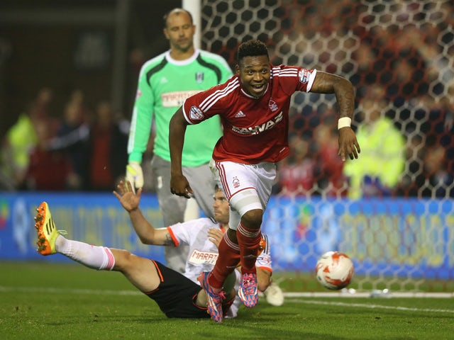 Britt Assombalonga of Nottingham Forest celebrates after scoring their fourth goal and his hattrick during the Sky Bet Championship match between Nottingham Forest and Fulham at the City Ground on September 17, 2014