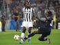 Paul Pogba (L) of Juventus is tackled by Pa Konate of Malmo FF during the UEFA Champions League Group A match between Juventus and Malmo FF on September 16, 2014