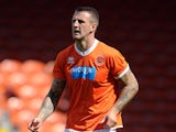Peter Clarke of Blackpool in action during the Pre Season Friendly match between Blackpool and Burnley at Bloomfield Road on August 2, 2014
