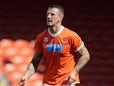 Peter Clarke of Blackpool in action during the Pre Season Friendly match between Blackpool and Burnley at Bloomfield Road on August 2, 2014