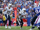 Philip Rivers #17 of the San Diego Chargers hands off to Donald Brown against the Buffalo Bills on September 21, 2014