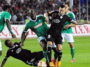 Renaud Cohade of Saint-Etienne vies for a ball with Reynaldo and Leroy George of Qarabag FK from Agdam, on September 18, 2014