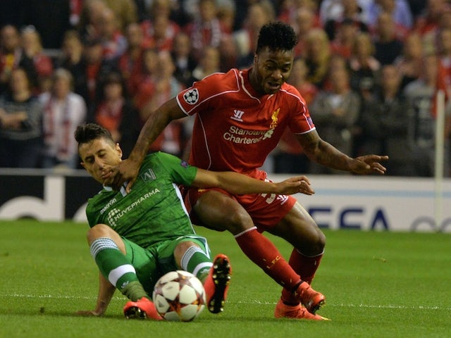 Liverpool's English midfielder Raheem Sterling (R) vies for the ball with Ludogorets Razgrad's Mihail Aleksandrov during the UEFA Champions League Group B match on September 16, 2014