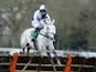 Richie McGrath riding Stopped Out clear the last to win The bet365 Handicap Hurdle Race at Sandown racecourse on April 27, 2013