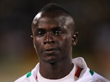 Sadio Mane of Senegal lines up for the National Anthem during the FIFA 2014 World Cup Qualifier Play-off Second Leg between Senegal and Ivory Coast at Stade Mohammed V on November 16, 2013