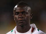 Sadio Mane of Senegal lines up for the National Anthem during the FIFA 2014 World Cup Qualifier Play-off Second Leg between Senegal and Ivory Coast at Stade Mohammed V on November 16, 2013