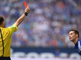 Referee Markus Schmidt shows the red card to Schalke's midfielder Julian Draxler during the German first division Bundesliga football match FC Schalke 04 vs Eintracht Frankfurt at the Veltins Arena in Gelsenkirchen, western Germany on September 20, 2014