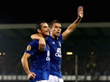 Seamus Coleman (R) of Everton celebrates with teammate Leighton Baines of Everton after scoring his team's second goal during the UEFA Europa League against Wolfsburg on September 18, 2014