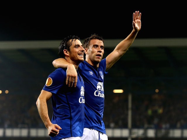 Seamus Coleman (R) of Everton celebrates with teammate Leighton Baines of Everton after scoring his team's second goal during the UEFA Europa League against Wolfsburg on September 18, 2014