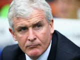 Mark Hughes, manager of Stoke City looks on during the Barclays Premier League match between Queens Park Rangers and Stoke City at Loftus Road on September 20, 2014