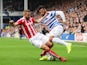 Armand Traore of QPR is tackled by Phil Bardsley of Stoke City during the Barclays Premier League match between Queens Park Rangers and Stoke City at Loftus Road on September 20, 2014 