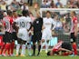 Swansea City`s Ivorian striker Wilfried Bony receives a red card from referee Jon Moss after making a second bookable tackle on Southampton`s Maya Yoshida during the English Premier League football match between Swansea City and Southampton at the Liberty