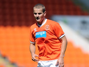Tomasz Cywka of Blackpool in action during the Pre Season Friendly match between Blackpool and Burnley at Bloomfield Road on August 2, 2014