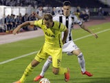 Harry Kane of Tottenham Hotspur is challenged by Danilo Pantic of Partizan during the UEFA Europa League match between Partizan and Tottenham Hotspur at the Stadium JNA on September 18, 2014