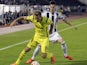Harry Kane of Tottenham Hotspur is challenged by Danilo Pantic of Partizan during the UEFA Europa League match between Partizan and Tottenham Hotspur at the Stadium JNA on September 18, 2014