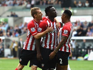 Southampton player Victor Wanyama celebrates with team mates after scoring the first goal during the Barclays Premier League match between Swansea City and Southampton at Liberty Stadium on September 20, 2014