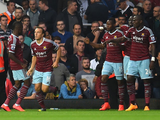 Diafra Sakho #15 of West Ham is congratulated by teammates after scoring his team's second goal during the Barclays Premier League match between West Ham United and Liverpool at Boleyn Ground on September 20, 2014