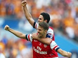 Aaron Ramsey (L) and Mikel Arteta of Arsenal (R) celebrate victory after the FA Cup with Budweiser Final match between Arsenal and Hull City at Wembley Stadium on May 17, 2014