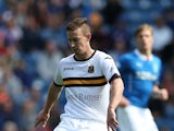 Archie Campbell of Dumbarton controls the ball during the Scottish Championship League Match between Rangers and Dumbarton, at Ibrox Stadium on August 23, 2014