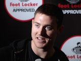 NBA player Aron Baynes speaks to the media during a Footlocker in store appearance on July 15, 2014