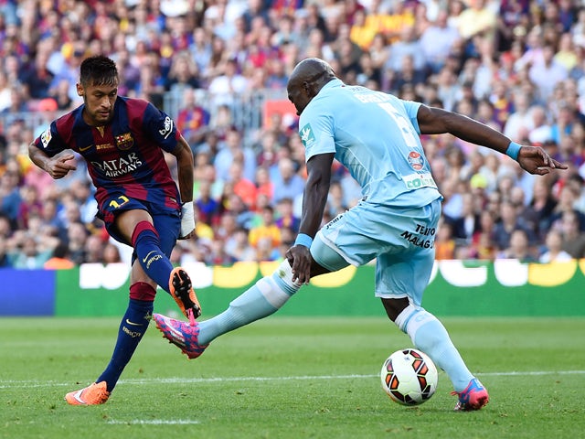 Neymar of FC Barcelona scores the opening goal past Diego Mainz of Granda CF during the La Liga match between FC Barcelona and Granada CF at Camp Nou on September 27, 2014